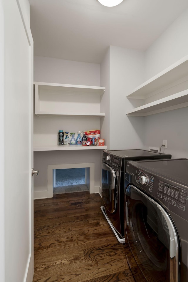 laundry room with independent washer and dryer and dark hardwood / wood-style floors