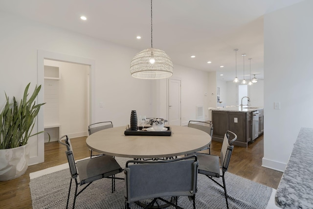 dining room featuring dark hardwood / wood-style flooring and sink