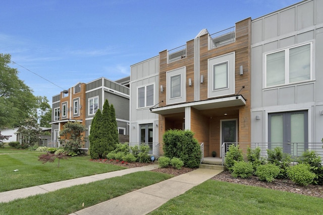 view of property featuring a front yard