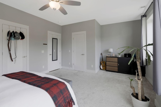 carpeted bedroom with ceiling fan