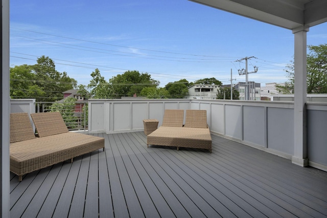 wooden deck with an outdoor living space