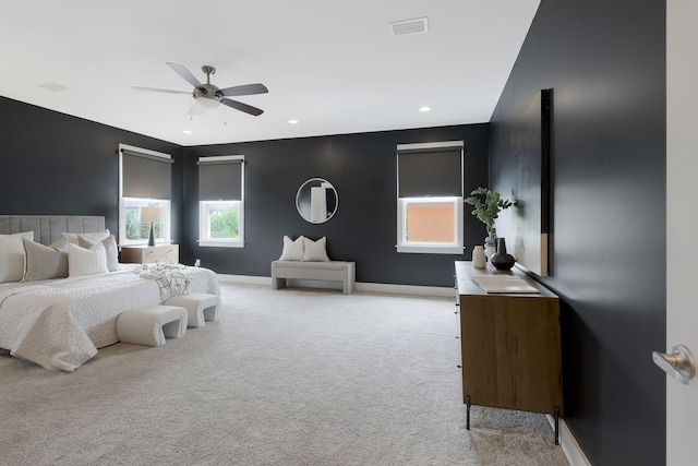 bedroom featuring ceiling fan and light colored carpet