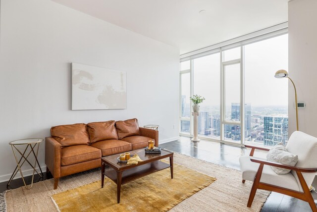 living room with expansive windows and hardwood / wood-style floors