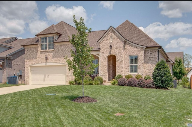 french country inspired facade with central AC, a garage, and a front yard