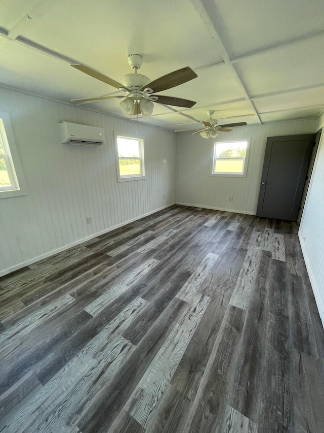 interior space featuring ceiling fan, dark hardwood / wood-style flooring, and a wall mounted AC