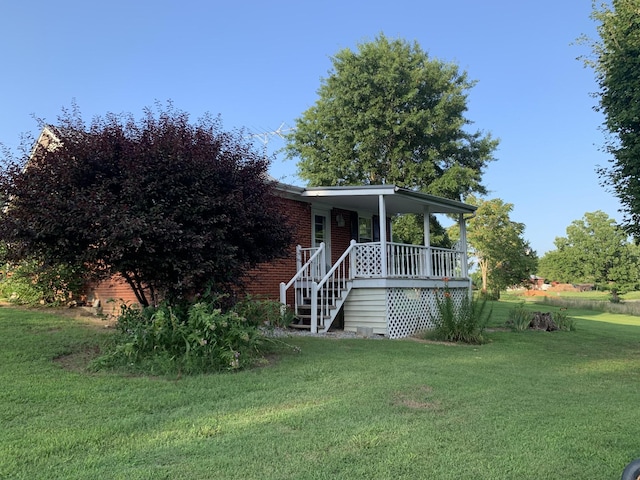 view of front facade with a porch and a front yard