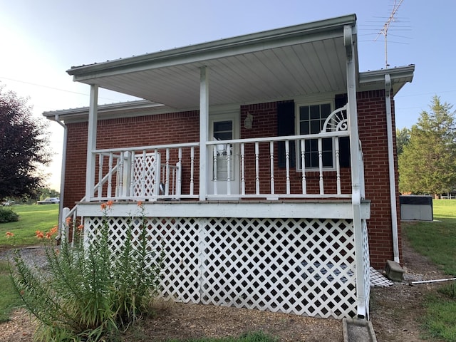 back of house featuring covered porch