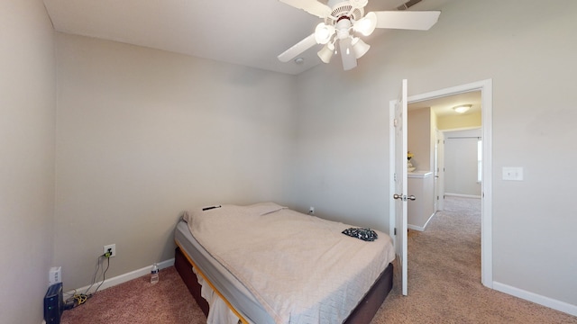 bedroom featuring light carpet and ceiling fan