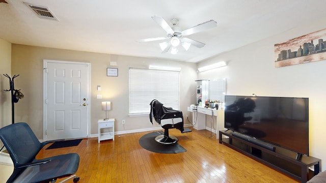 sitting room with ceiling fan and light hardwood / wood-style floors