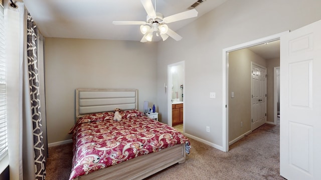 bedroom featuring carpet floors, ceiling fan, connected bathroom, and lofted ceiling