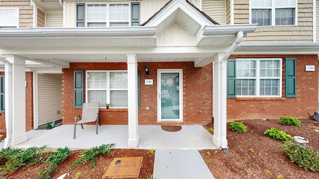 property entrance with covered porch