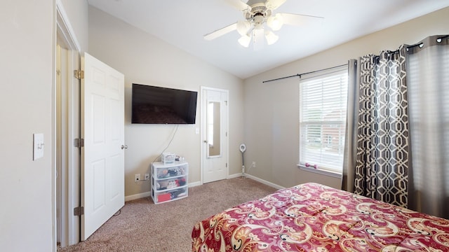 bedroom with carpet floors, ceiling fan, and vaulted ceiling