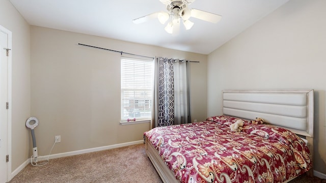 bedroom with light carpet, multiple windows, and ceiling fan