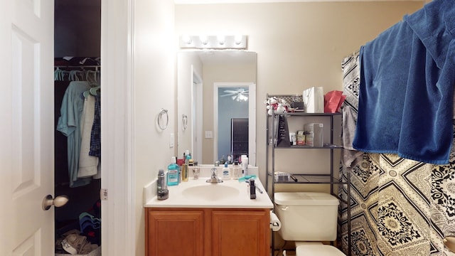 bathroom with toilet and vanity