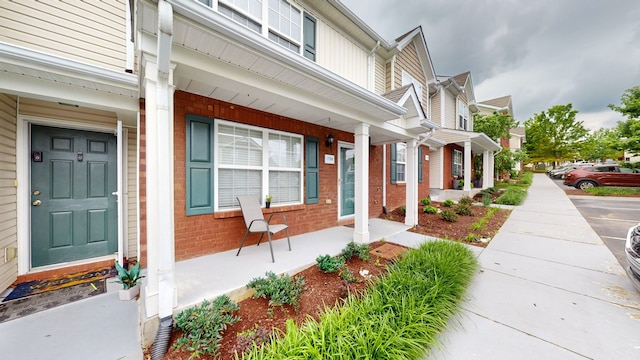 view of exterior entry featuring a porch