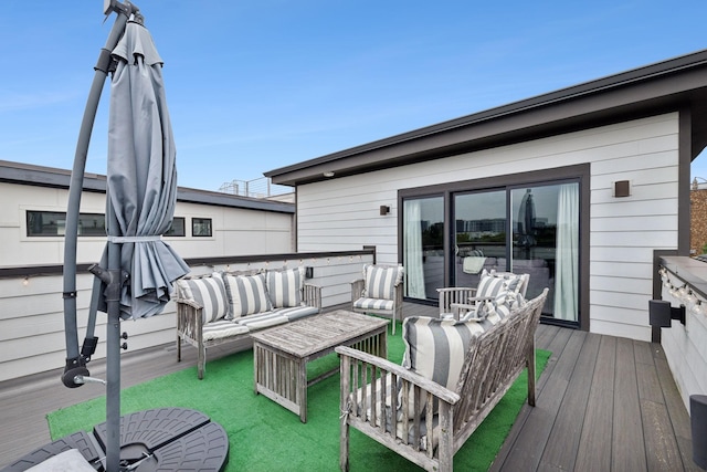 wooden deck featuring an outdoor hangout area