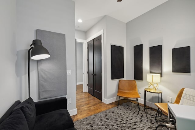 sitting room with hardwood / wood-style floors