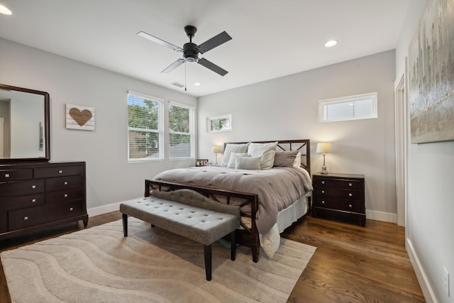 bedroom featuring ceiling fan and dark hardwood / wood-style flooring