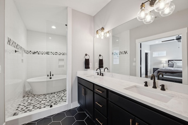 bathroom with tile patterned floors, vanity, and separate shower and tub