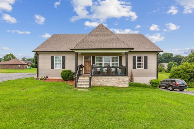 view of front of property with a porch and a front lawn