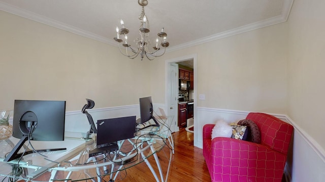 office area with an inviting chandelier, hardwood / wood-style floors, and ornamental molding