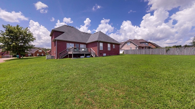 view of yard with a wooden deck