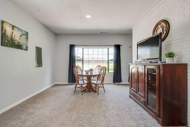 dining area with light carpet