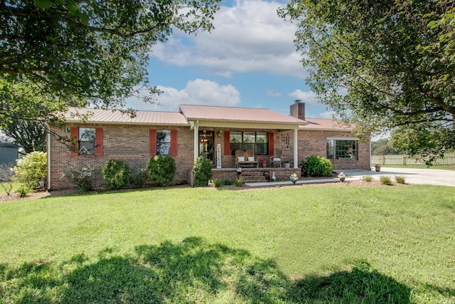 ranch-style house with a porch and a front yard