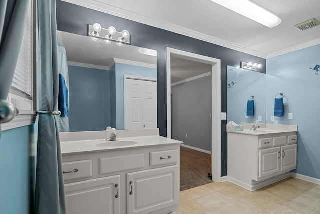 bathroom with ornamental molding, tile patterned floors, and double sink vanity