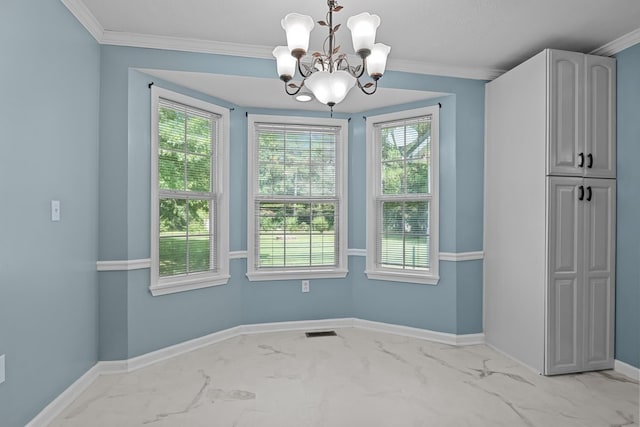 unfurnished dining area with a healthy amount of sunlight, crown molding, and an inviting chandelier