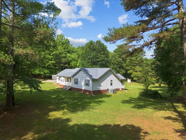 view of home's exterior with a lawn