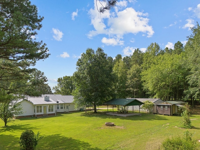 view of yard with a patio, a gazebo, and a fire pit