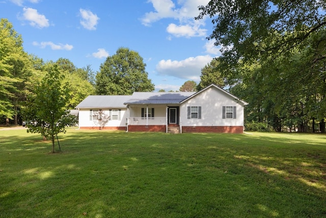 ranch-style home with covered porch and a front lawn