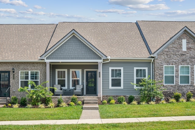 view of front facade with an outdoor hangout area and a front lawn