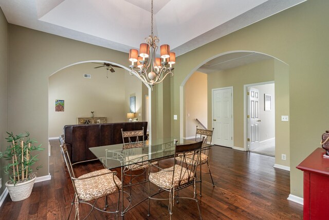 dining space featuring an inviting chandelier and dark hardwood / wood-style floors