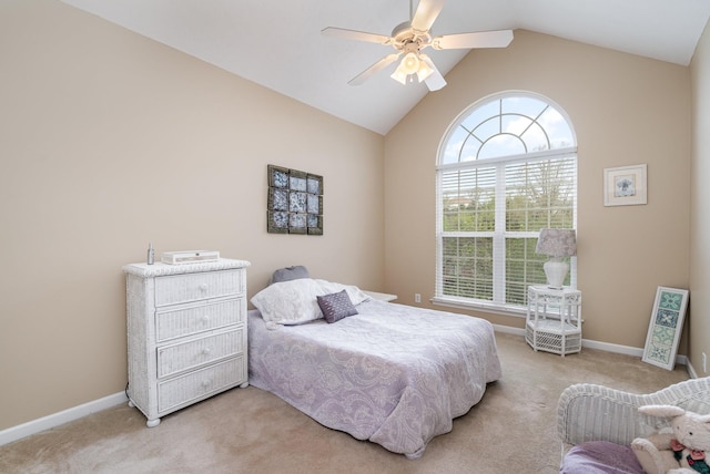 carpeted bedroom featuring vaulted ceiling and ceiling fan