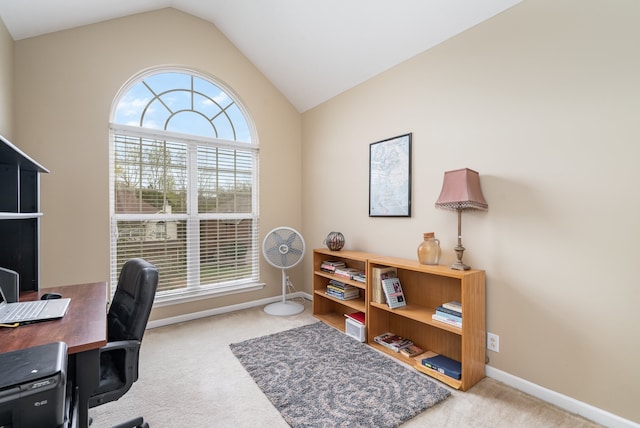 office area featuring light colored carpet and vaulted ceiling