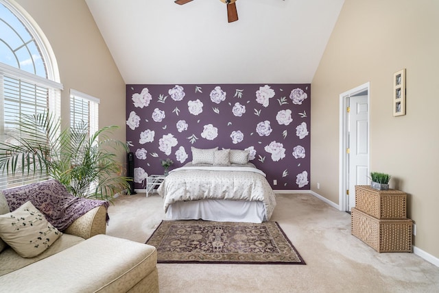 bedroom with light carpet, ceiling fan, and high vaulted ceiling