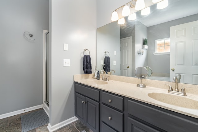 bathroom featuring tile patterned flooring, double vanity, and walk in shower