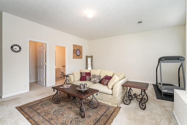 living room featuring light carpet