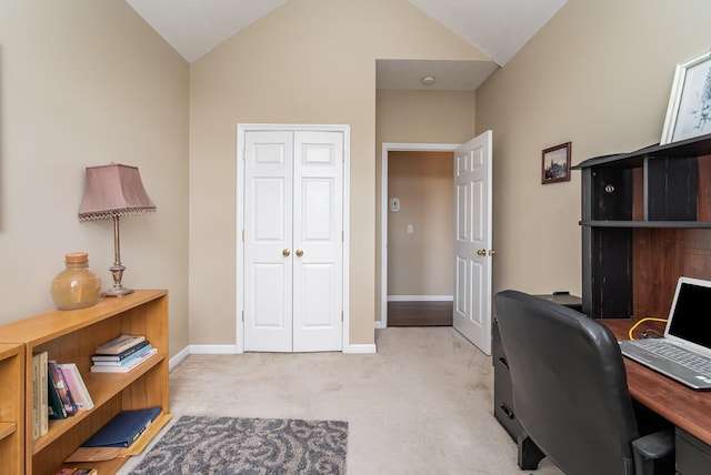 carpeted office space with lofted ceiling