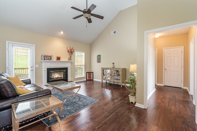 living room featuring high vaulted ceiling, dark hardwood / wood-style floors, and ceiling fan