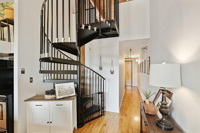 stairway featuring hardwood / wood-style flooring