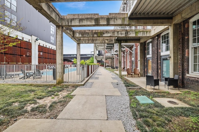 surrounding community featuring a pergola and a swimming pool