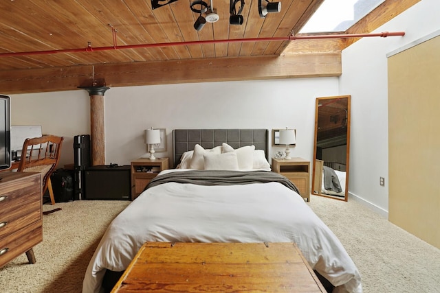 carpeted bedroom featuring wood ceiling and beam ceiling