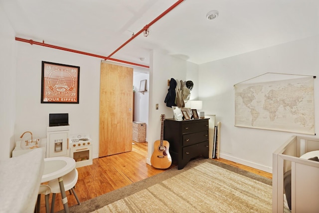 bedroom featuring hardwood / wood-style floors