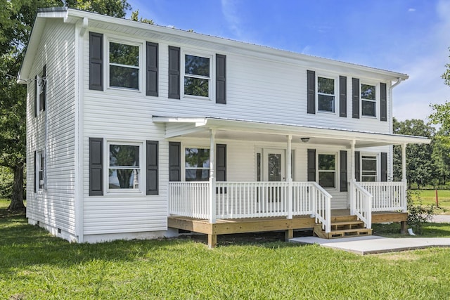 view of front of house featuring covered porch and a front lawn