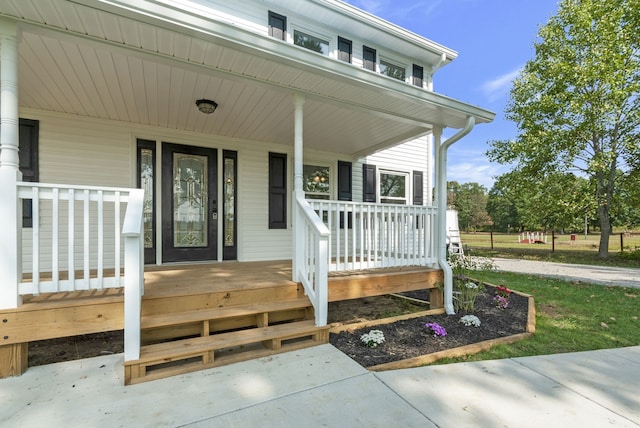 doorway to property with covered porch