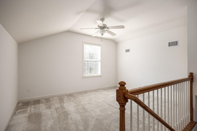 additional living space with ceiling fan, lofted ceiling, and light carpet