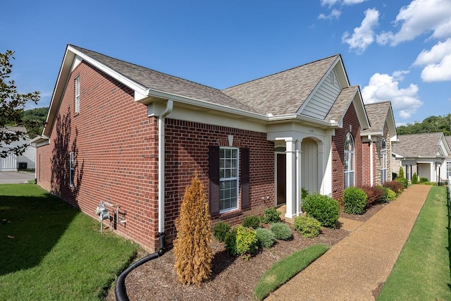 view of home's exterior with a lawn